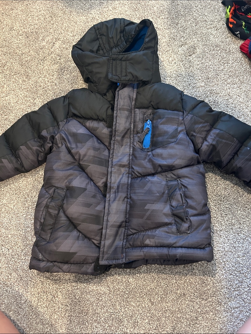 Xersion Boys Black and Gray Puffer Jacket with Hood. Tear in armpit